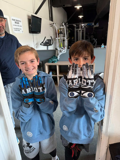 Charlotte skyline showcasing Carolina Batties Custom Prints gloves with leather front and sublimation back
